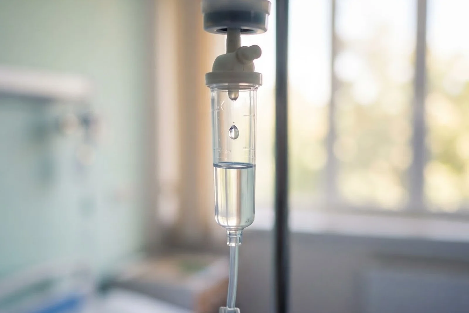 A droplet forming inside an IV drip chamber